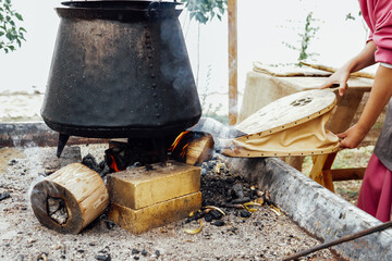 Cooking delicious hot food on a fire fire