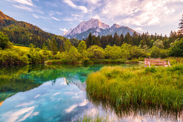 Fototapeta premium Beautiful Zelenci lake in the Julia Alps in Triglav National Park near Kranjska Gora at sunset
