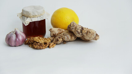 natural vitamins in winter, honey, garlic, ginger and lemon for virus prevention