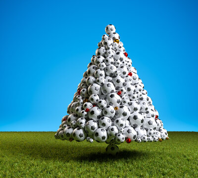 3D render: Soccer christmas - A christmas tree made from soccer balls and with red and golden christmas baubles on a meadow