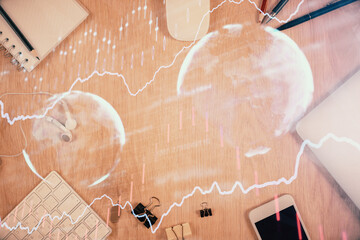 Multi exposure of forex graph hologram over desktop with phone. Top view. Mobile trade platform concept.