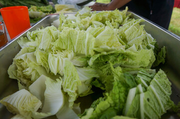 fresh mustard greens at a market stall