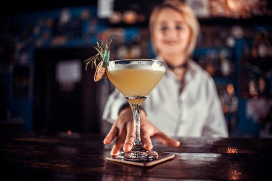 Girl barman creates a cocktail at the porterhouse