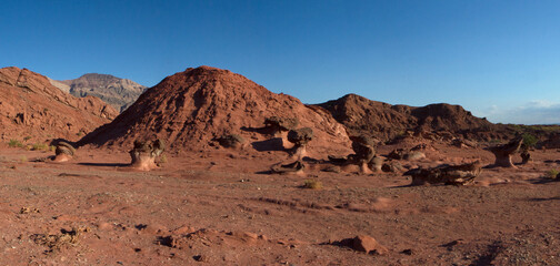Geology. The red canyon. Panorama view of the arid desert, valley, sandstone and rocky formations and mountains in Talampaya national park in La Rioja, Argentina.