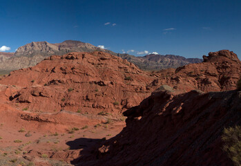 The red canyon. Panorama view of the arid desert, valley, sandstone, rocky formations and mountains in Talampaya national park in La Rioja, Argentina.