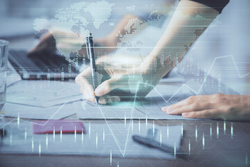 Multi exposure of woman hands typing on computer and financial chart hologram drawing. Stock market analysis concept.