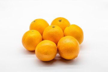 Seven pieces of orange fruits isolated on white background