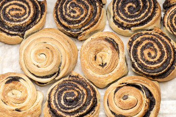 puff pastry with poppy seeds on a plate. close up view. various of a tasty pastry. homemade baking concept. background backdrop. studio shot