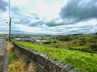 Fototapeta na wymiar Landscape view from, Windy Bank Lane, looking toward Halifax, on a cloudy day
