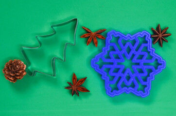 Christmas cookie molds in the shape of a christmas tree and snowflake, creative food concept