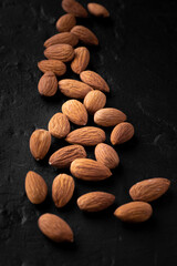 Roasted almonds on volcanic black rock