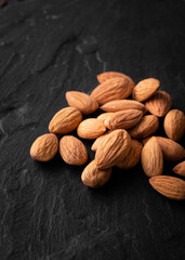 Roasted almonds on volcanic black rock