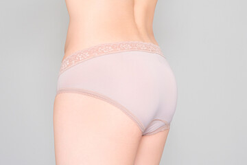 Skin and shape of a woman wearing  underwear on a white background. Health and beauty concepts