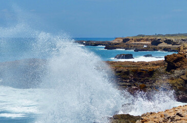 Waves of the Pacific Ocean crashing against the rock at La Chocolatera. Santa Elena province, Salinas, Ecuador