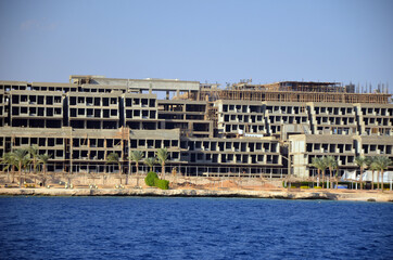 Fototapeta premium The view of resorts and hotels at coast of Sharm El Sheikh from yacht. Red Sea, Egypt 
