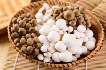 Fresh brown and white Shimeji mushroom in a bamboo basket, Asian mushroom