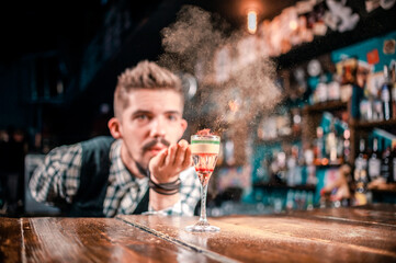 Barman concocts a cocktail on the taproom