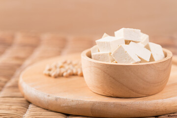 Fresh cube tofu in a wooden bowl prepare for cooking, Asian vegan food