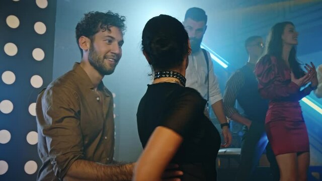 Let's Dance Together. Couple at the dance floor in nightclub