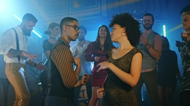 Let's Dance Together. Couple at the dance floor in nightclub