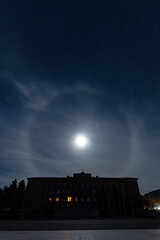 STEPANAKERT, ARTSAKH - Nov 05, 2020: Presidential Building crowned by a moon halo in Stepanakert