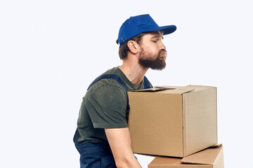 Working man with boxes in hands delivery service work lifestyle