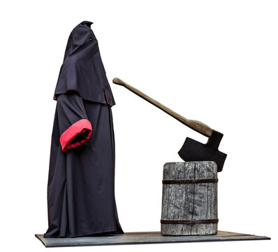 Medieval public executioner at place of separation of the head from the body beheading with an axe on a stump isolated on white.