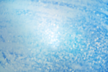 Fototapeta na wymiar Abstract blue bokeh blurred background from light