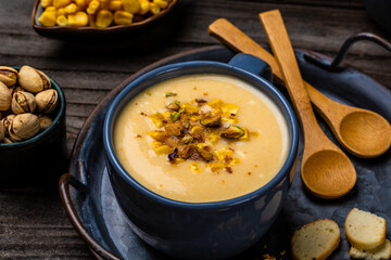 Creamy corn soup with roasted pistachios and croutons, Healthy food. Vegan cuisine. Restaurant menu, dieting, cookbook recipe