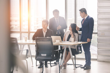 Fototapeta na wymiar business team Asian congratulating Colleague, Marketing Analysis Accounting Team Teamwork Business Meeting Concept.