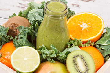 Freshly blended green coctail from fruits and vegetables. Diet and healthy nutrition concept