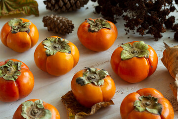Persimmons. Autumn background. 