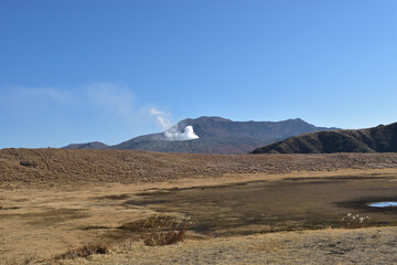 Image of Volcano and blue sky seen from the meadow