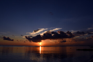 Naklejka na ściany i meble Colorful sunset over the ocean