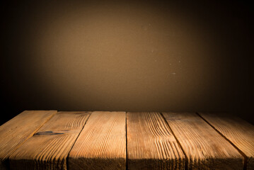 Background with wooden deck table on green grunge background