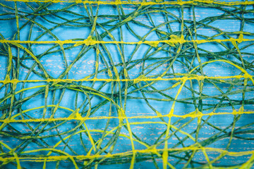 Abstract background of yellow threads on blue background