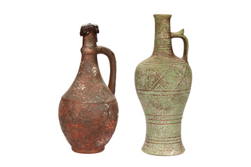 Closeup of antique wine jugs isolated on white background