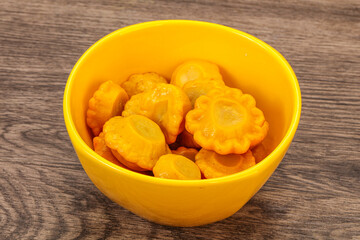 Marinated yellow patisson in the bowl
