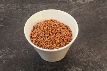 Raw buсkwheat cereal in the bowl