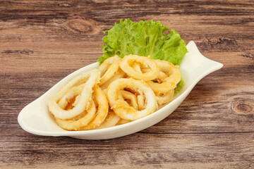 Roasted squid rings with salad