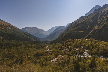 Canyon of mountain river with blue water. Autumn in Caucasus mountain. Hiking and eco tourism in mountain.