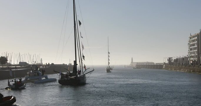 LES SABLES D'OLONNE, FRANCE - NOVEMBER 08, 2020: Alex Thomson boat (Hugo Boss) in the channel for the start of the Vendee Globe 2020 on November 08,2020. in Les Sables d'Olonne, France.