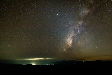 Night landscape with colorful Milky Way