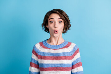 Fototapeta premium Photo of young charming girl shocked look excited wear colorful striped pullover isolated blue color background