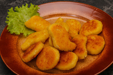 Fried chicken nuggets served salad leaves