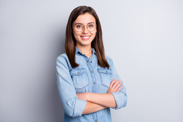 Portrait of optimistic intellectual long hairdo office worker crossed arms wear spectacles blue...