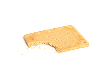 Closeup of a partially bitten delicious salty cracker on a white background
