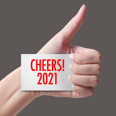 Cheers year 2021 with hand.