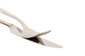 Closeup high angle shot of a knife and a for on a white surface