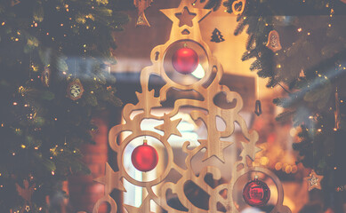 Christmas decorations in a shop window. Red decorations on blurred background. Christmas, winter, new year concept. Festive Christmas fair background.